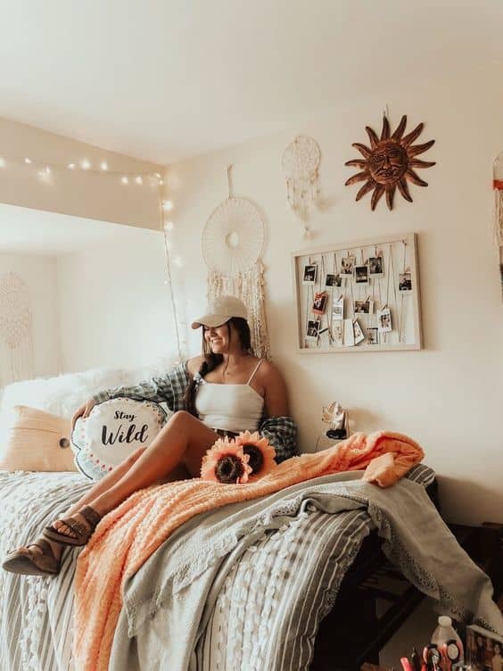 girl in boho dorm room