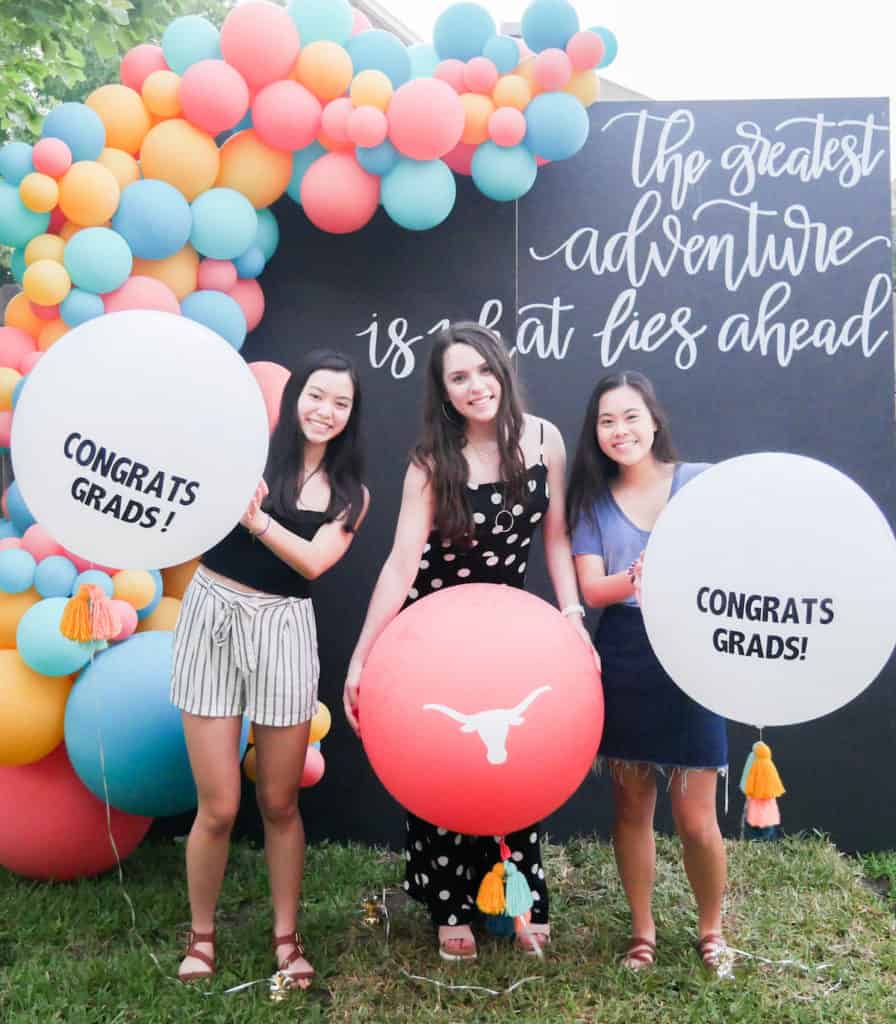 graduation party photo booth with balloon arch