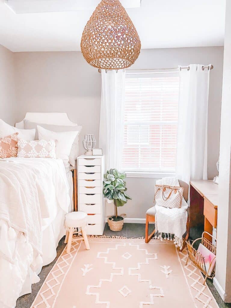 pink and white boho dorm room