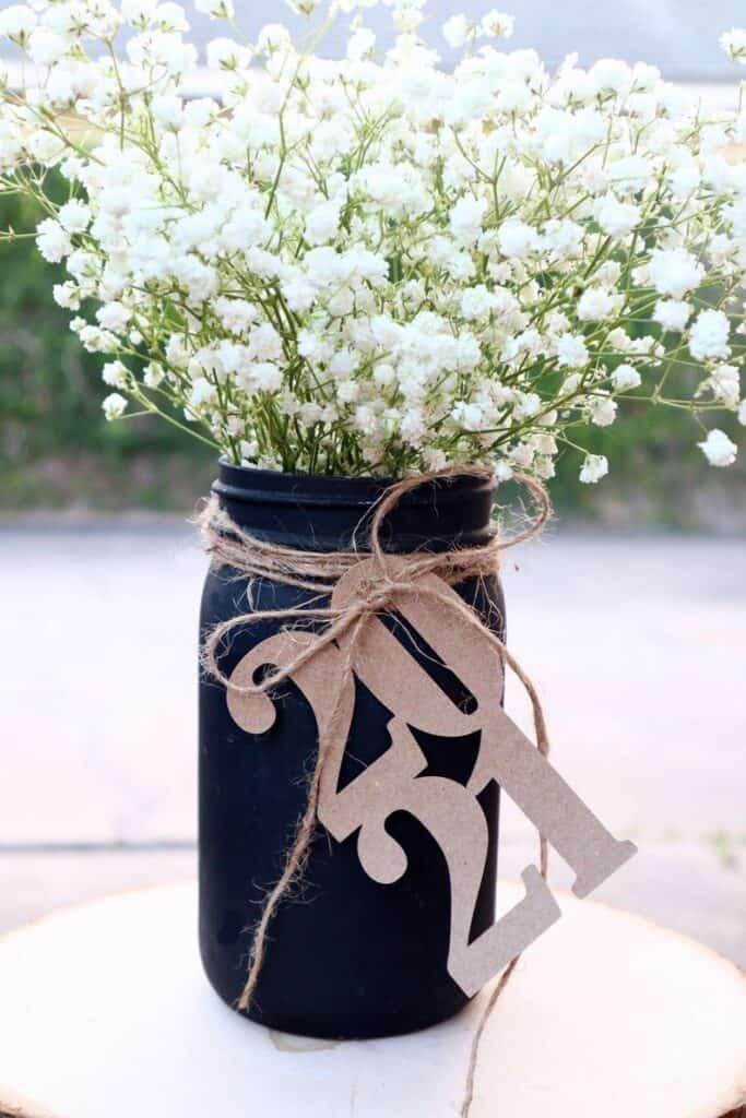 jar filled with white flowers