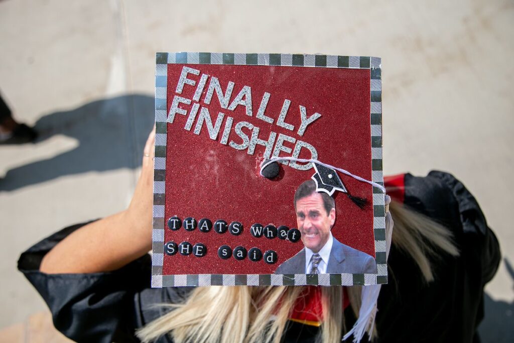 graduation cap with Michael Scott from The Office and the words finally finished that's what she said