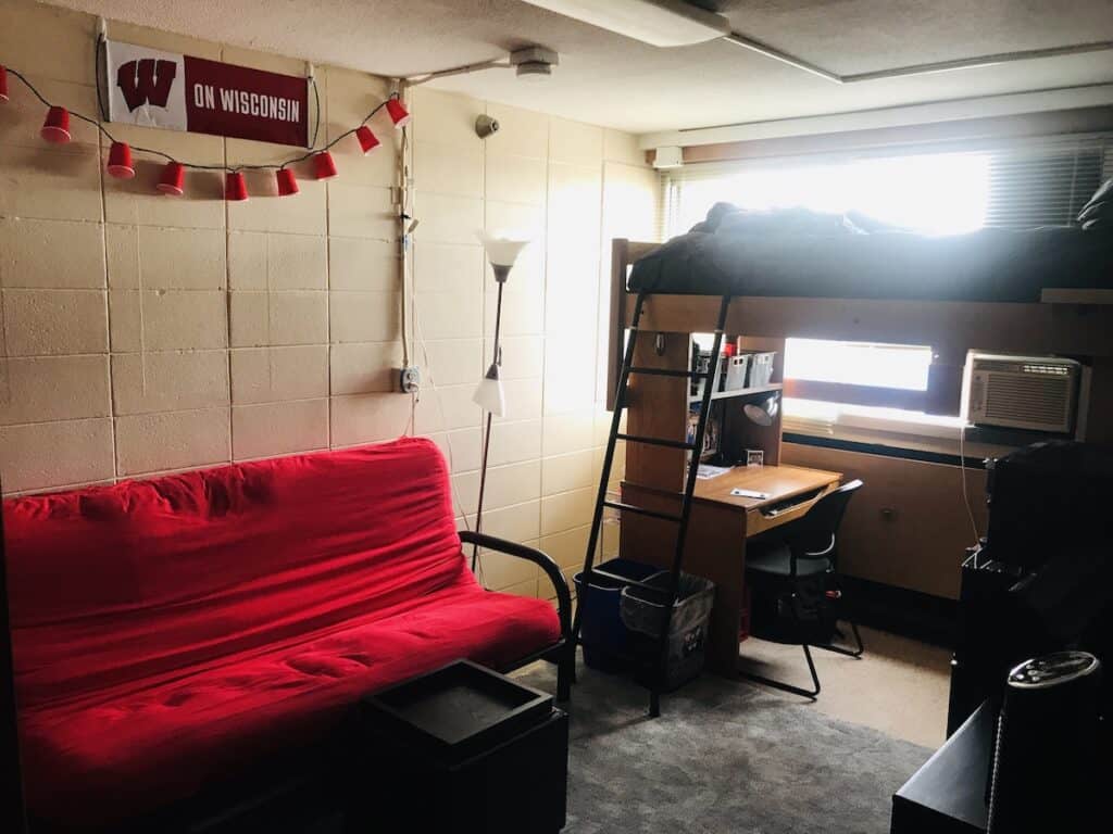 boys dorm room with red futon