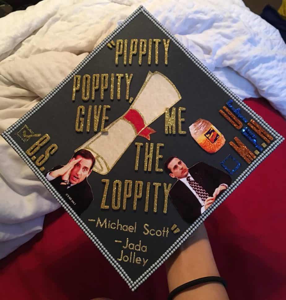 graduation cap with pictures of Michael Scott and the words Pippity Poppity give me the Zoppity