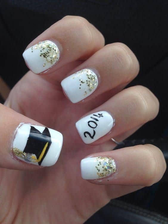 white nails with gold sparkles