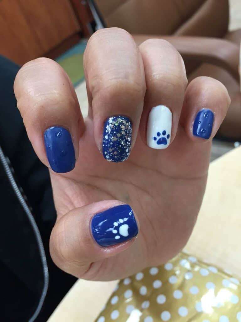 blue and white graduation nails