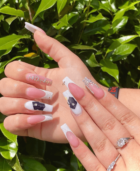 pink, white, and silver graduation nail polish design