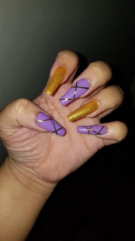 purple and gold nail design