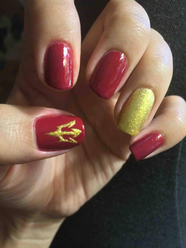 red and gold nails for graduation