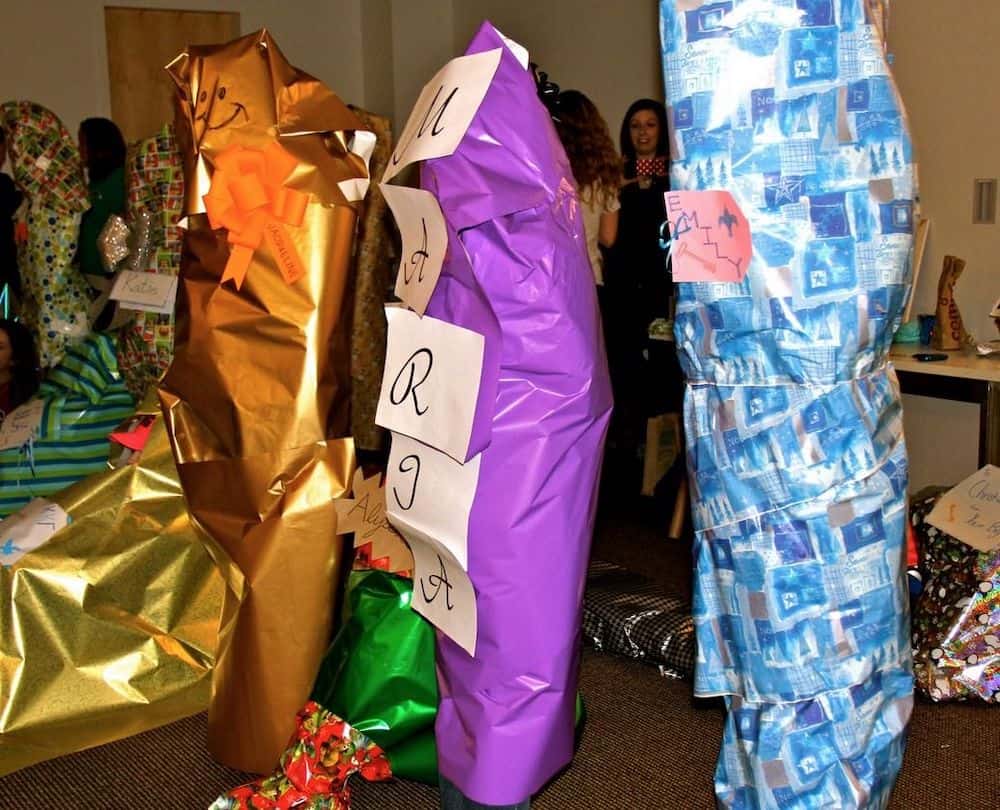 people wrapped in wrapping paper