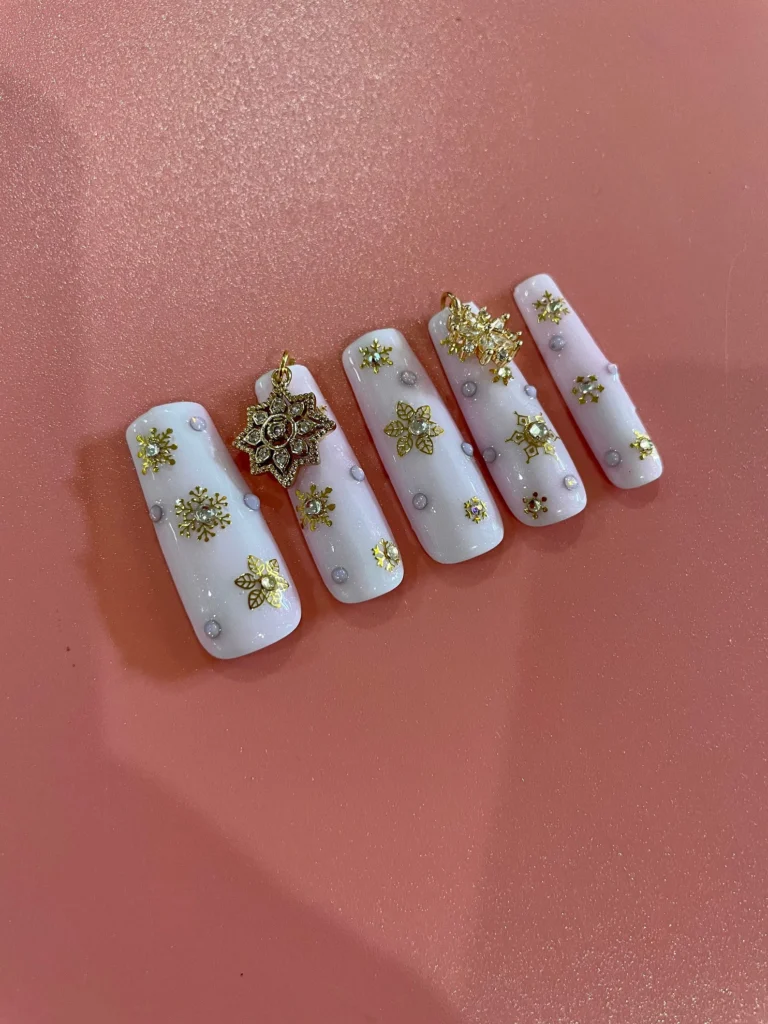 white and gold acrylic nails