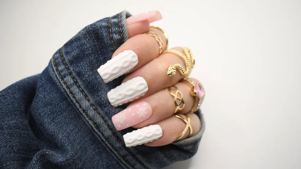 white nails with a sweater print