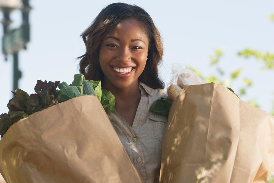 college student holding groceries